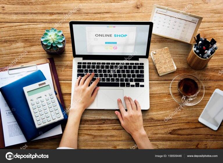 Hands working on laptop network graphic overlay